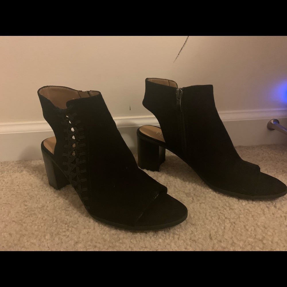 Black chunky open toe and heal boots.